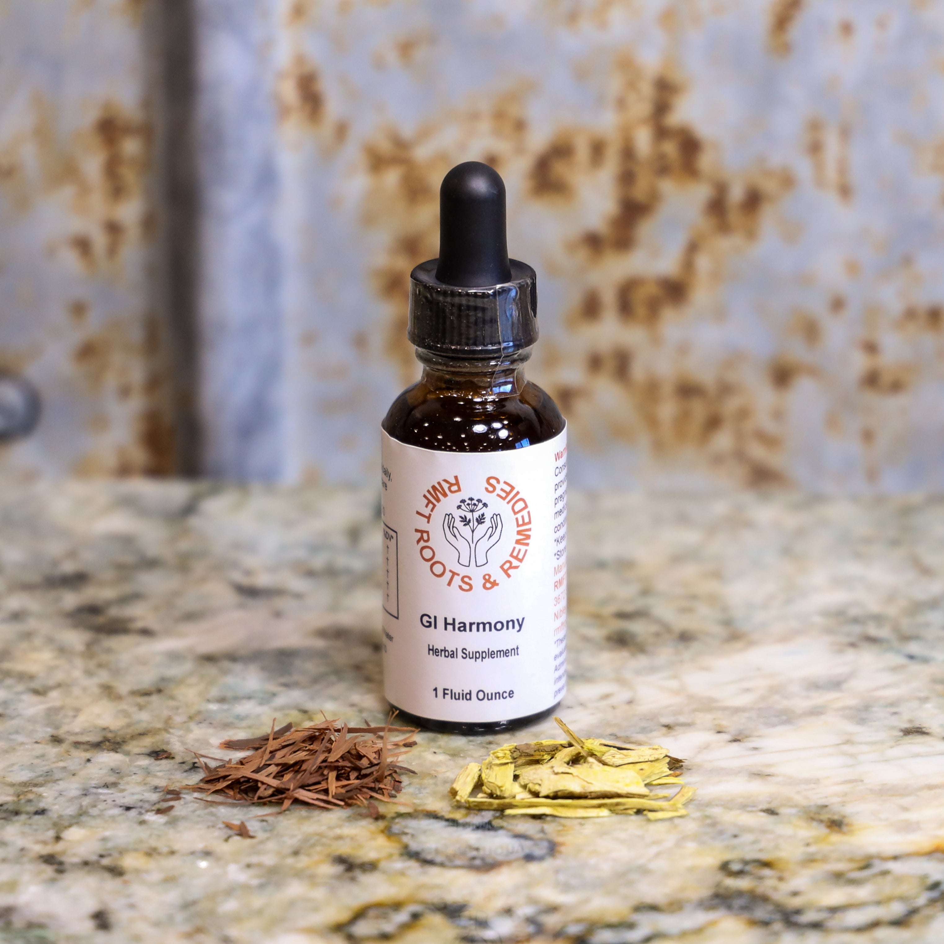 Bottle of 'GI Harmony' herbal supplement with dried herbs on a textured surface